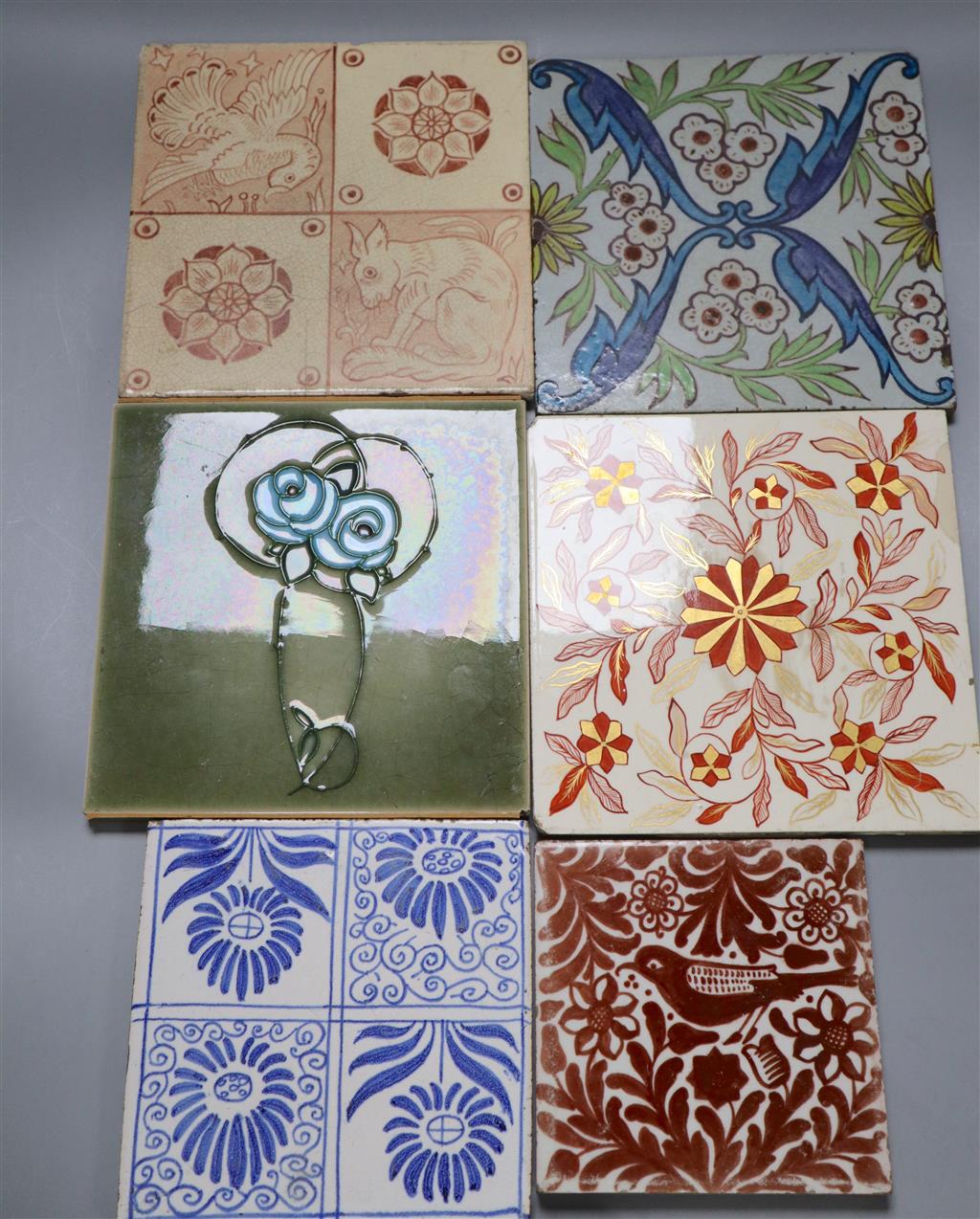 Two ceramic tiles in William de Morgan style and four other tiles, largest 15cm sq., ex Peter Creffield Collection